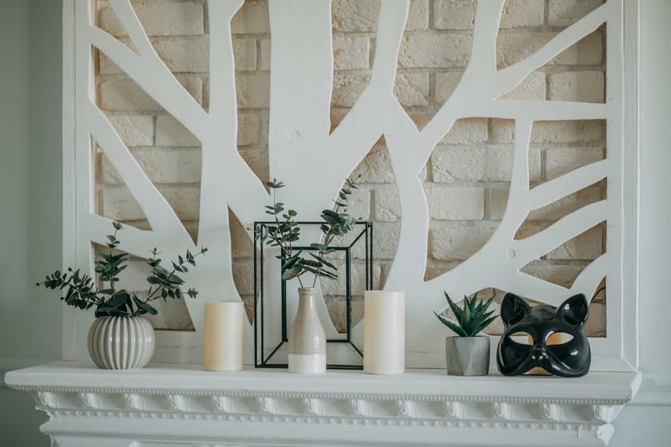 wood floating shelf above fireplace mantel